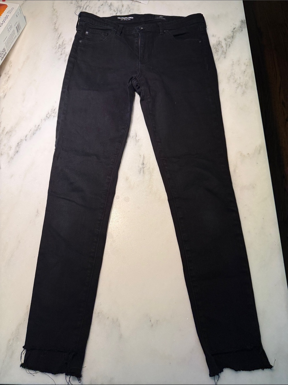 AG Black Skinny Ankle Jeans with Frayed Hem